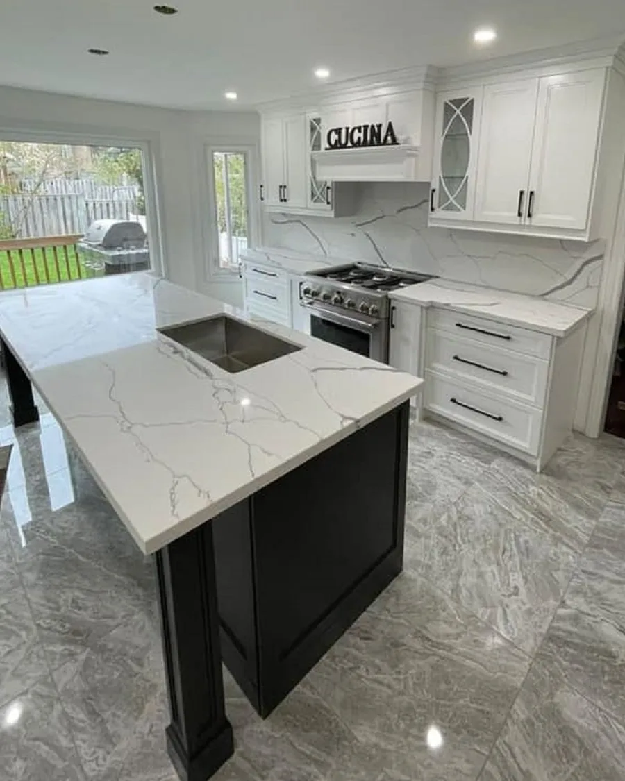 Dark kitchen with quartz waterfall island
